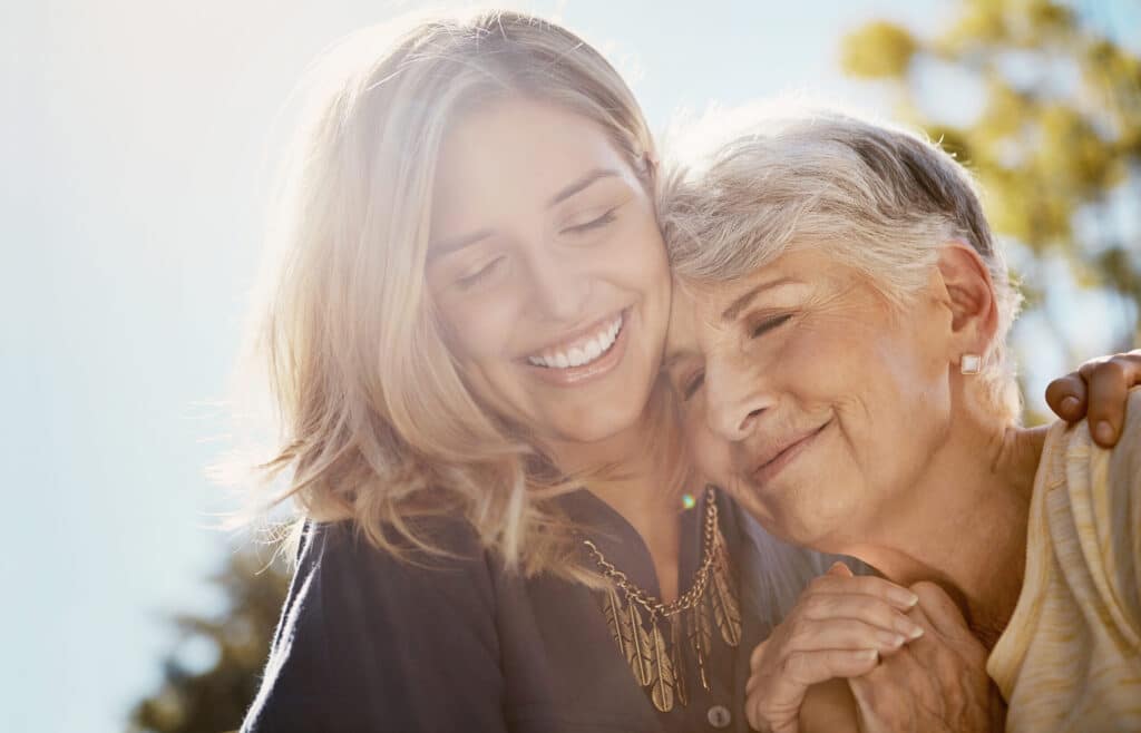 Two women looking happy outdoors